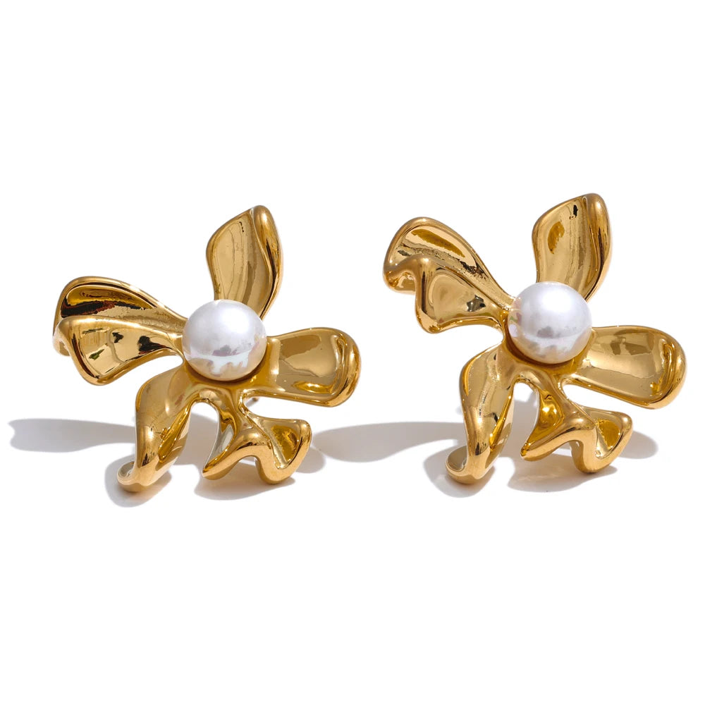 Gold plated flower stud earrings shown with gold jewelry elegance