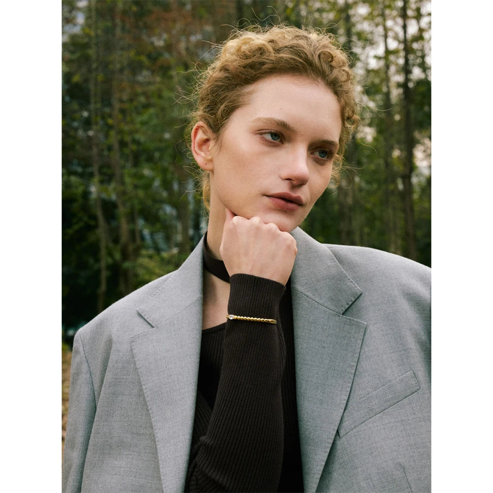 Minimal zircon detail on a cuff bracelet suited to bracelet bracelets stacks