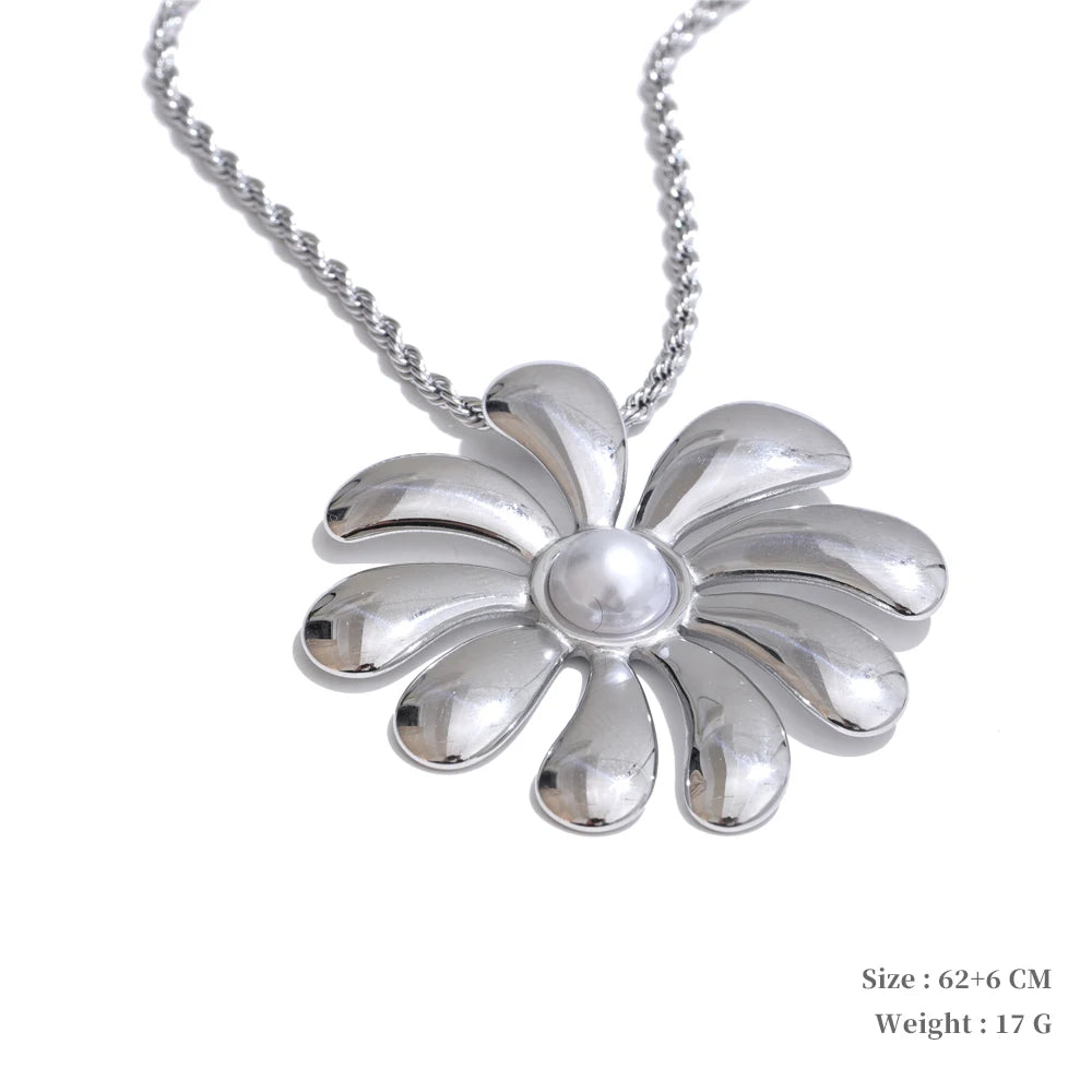 Elegant flower earrings complementing a necklace flower in stainless steel jewelry