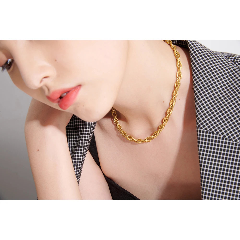 Necklace gold necklace layered beside a classic gold bracelet gold