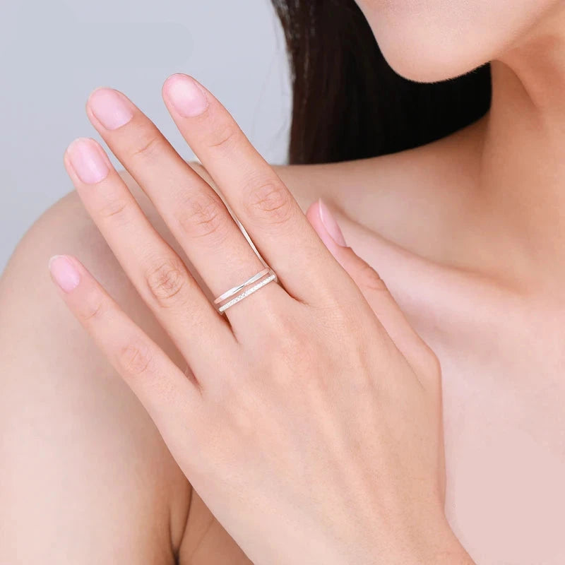 Sterling silver ring featuring cubic zirconia on a layered profile