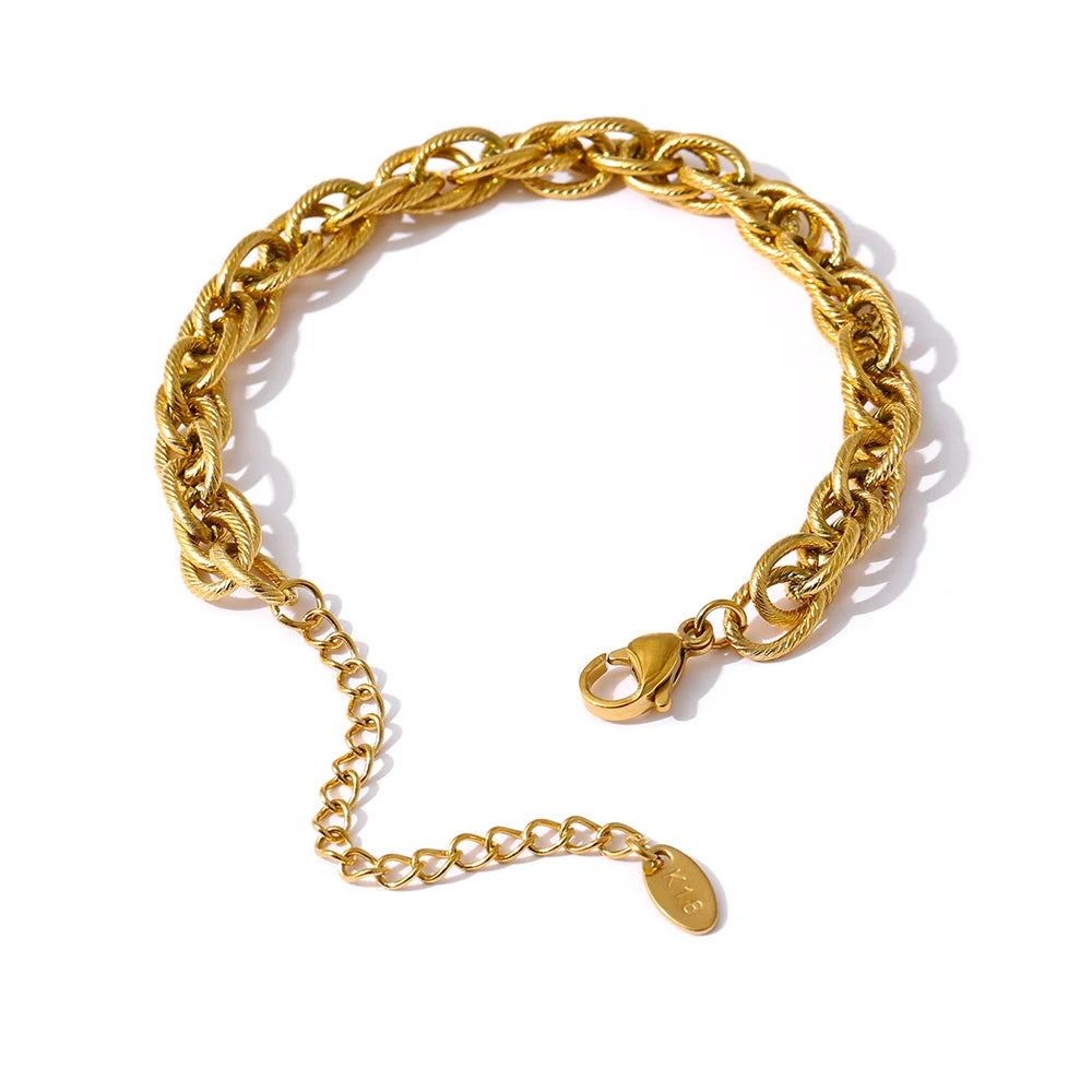 Minimal gold a chain style paired with a sleek gold i necklace