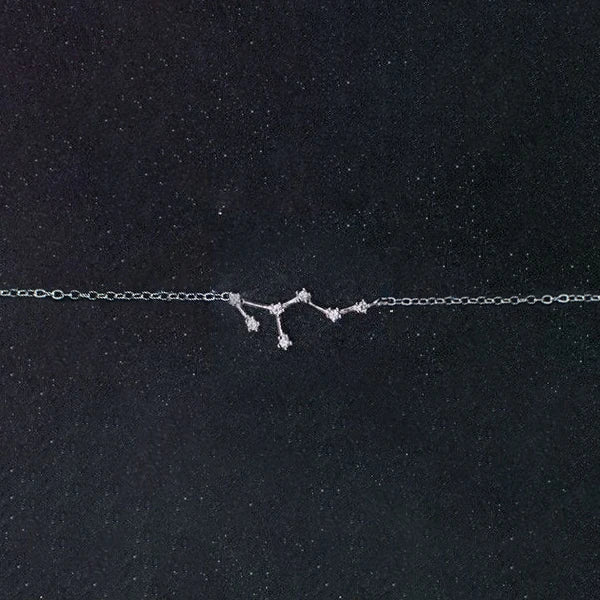 Silver bracelet bracelet stack complemented by a simple bracelet charm