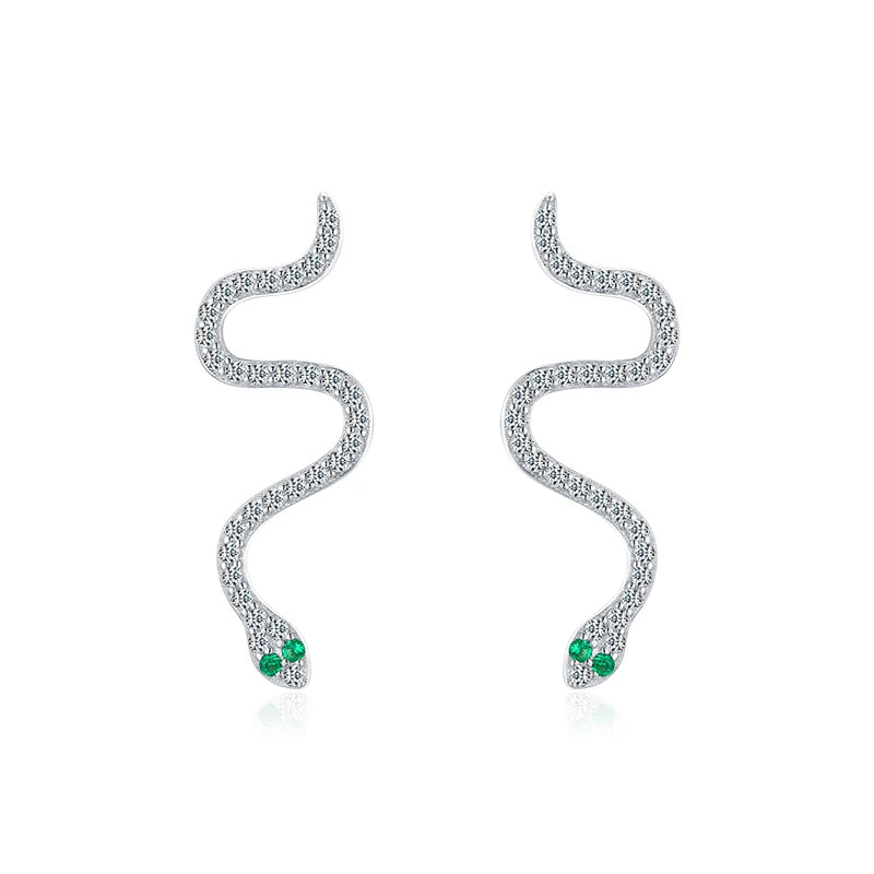 Silver hoops paired with sterling silver earrings for layered style