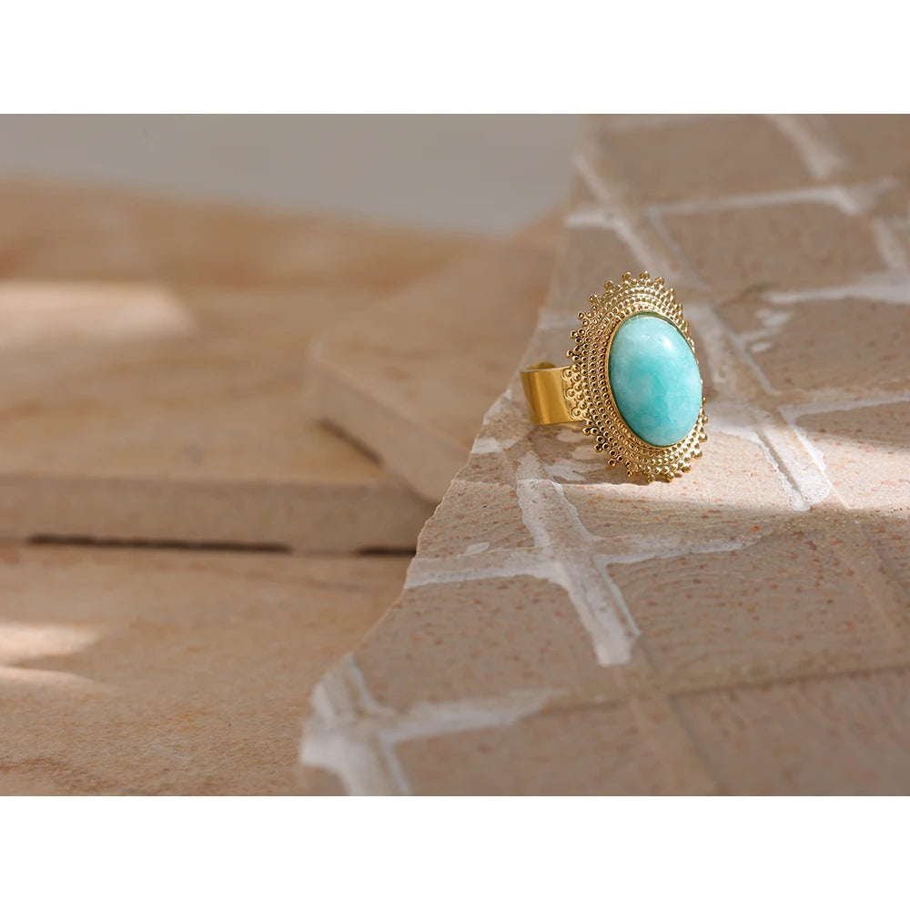 Bold gold ring with stone set in stainless steel band for women