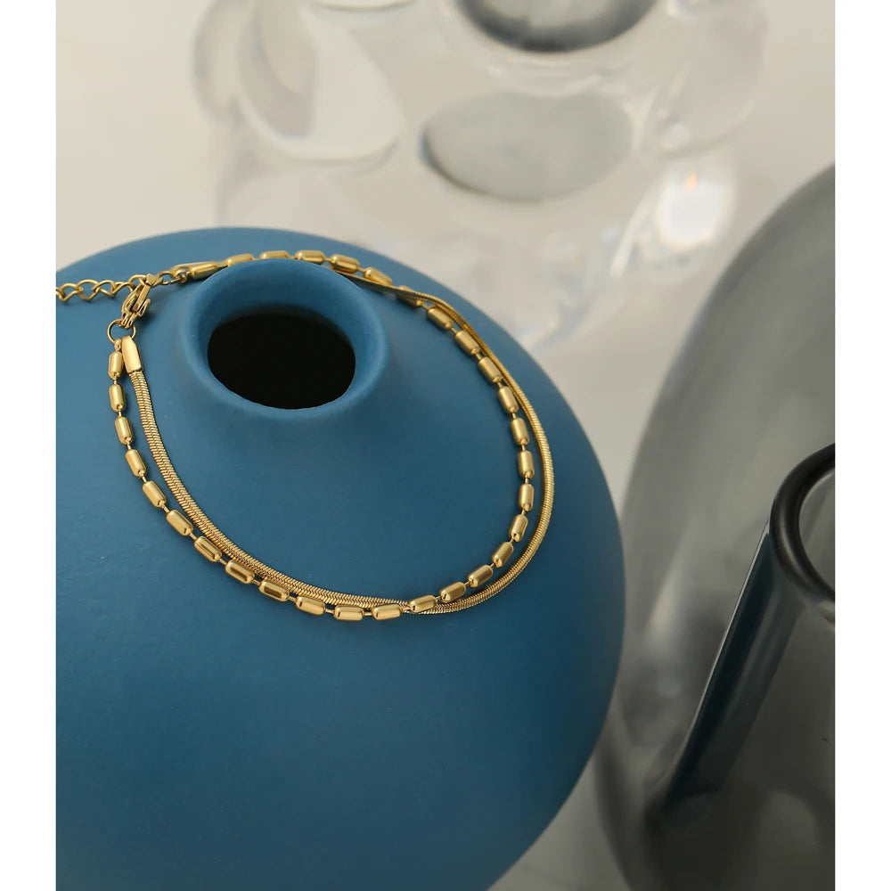 Gold bracelet for ladies presented as a bracelet charming golden jewelry piece