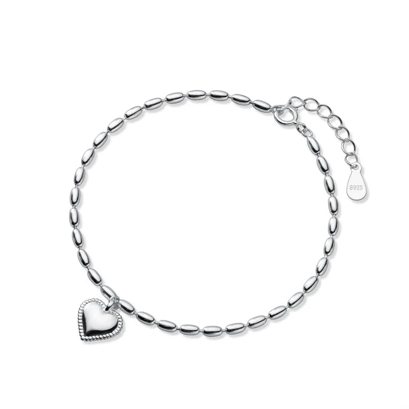 An adjustable sterling silver bracelet with a heart-shaped design and geometric oval link chains.
