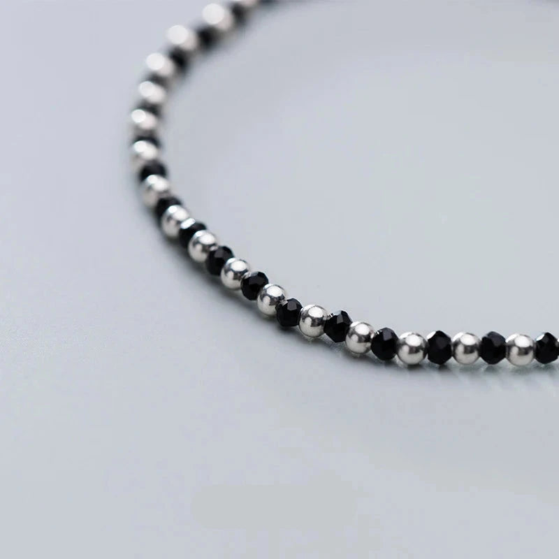 Sterling silver bracelet showcasing a luminous black crystal