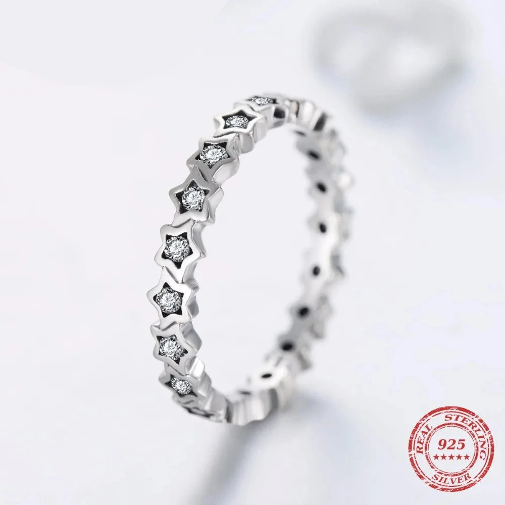 Silver ring with cubic zirconia set in a refined star ring design