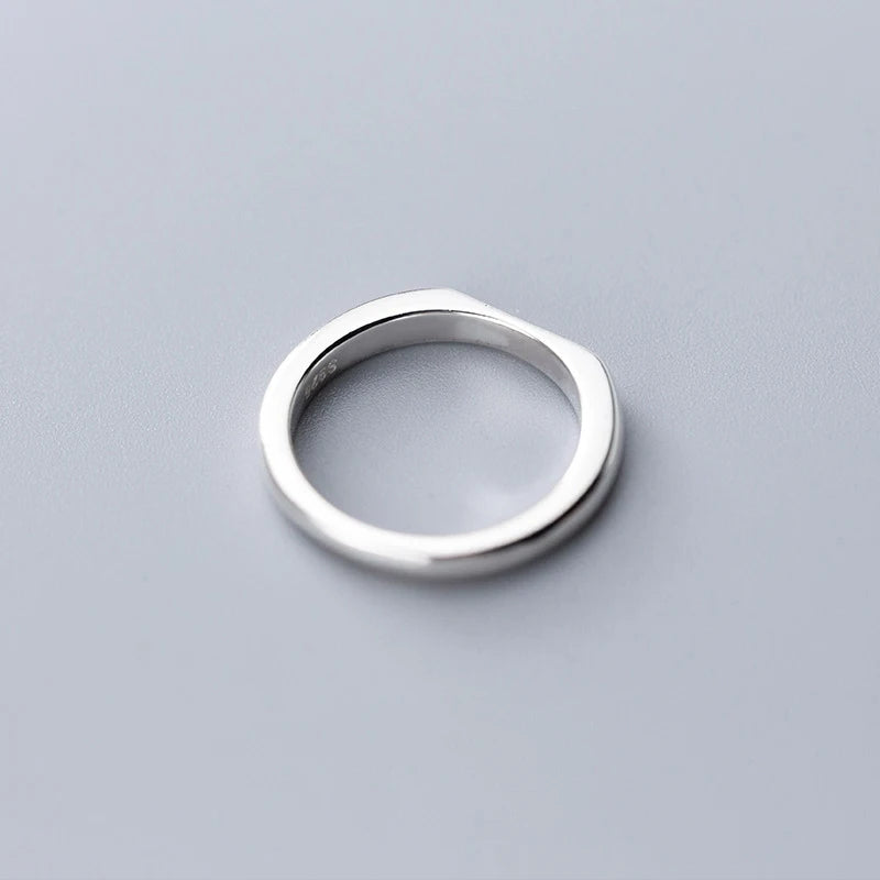 Classic sterling ring stacked with other sterling silver pieces