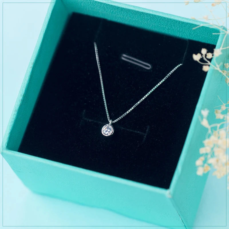 Chain necklace in sterling silver with subtle charm necklace detail