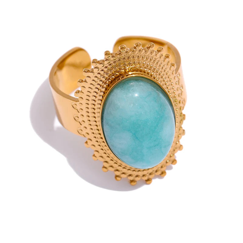 Gold plated stainless steel statement ring with central stone and charm accent