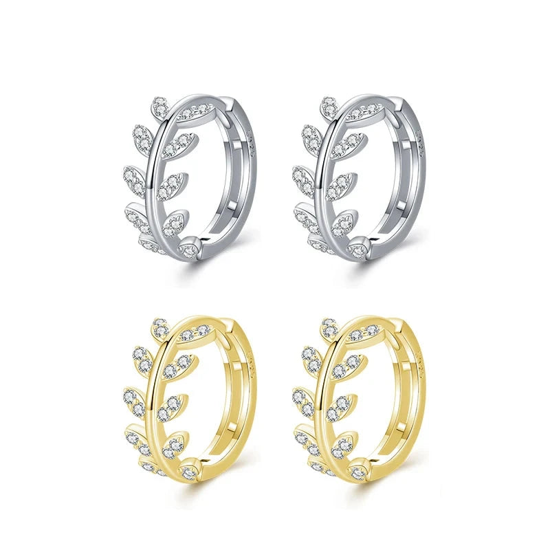 Sterling silver earrings shaped as silver hoop earrings with crystal jewelry shine