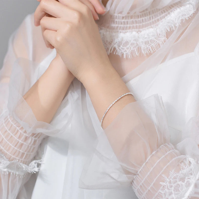 Elegant sterling silver bracelet showing subtle bracelet charm