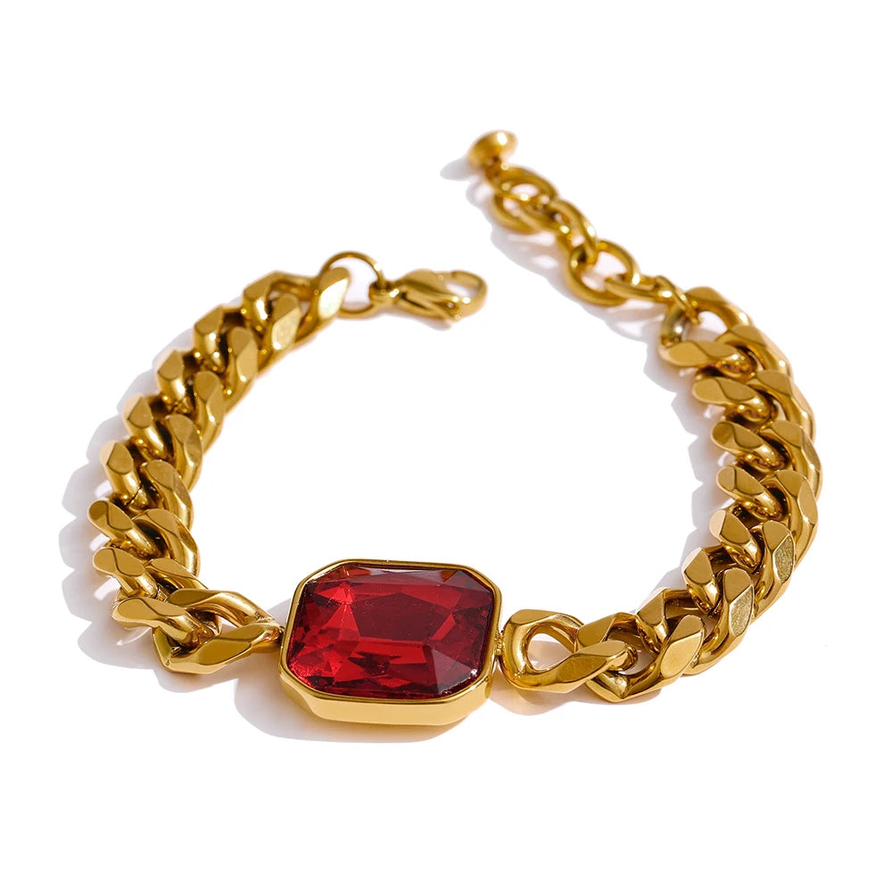 Elegant a gold bracelet stacked with other gold jewelry pieces