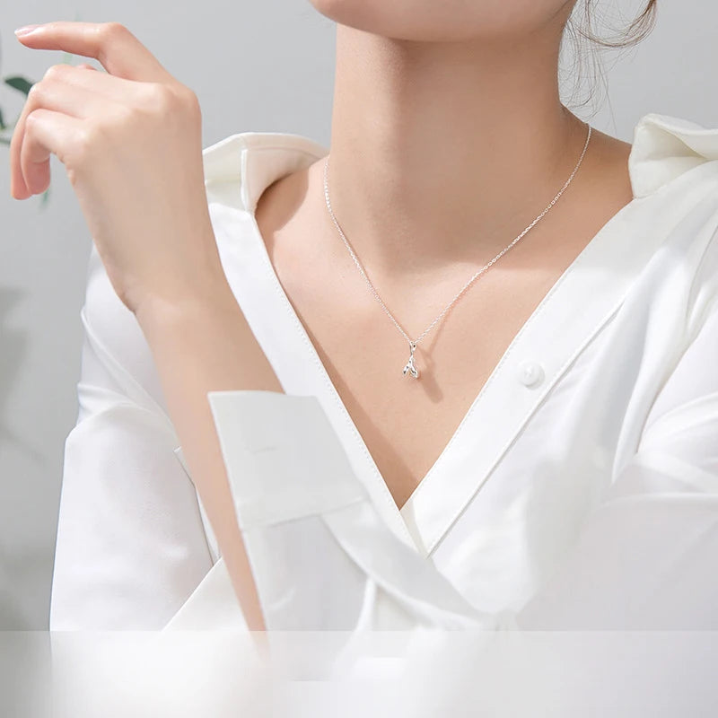 Charm necklace magnolia pendant on long silver chain