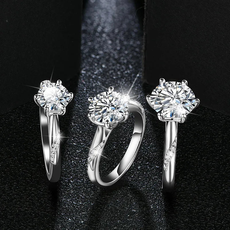 Hand wearing ring moissanite beside ring size from ring guide