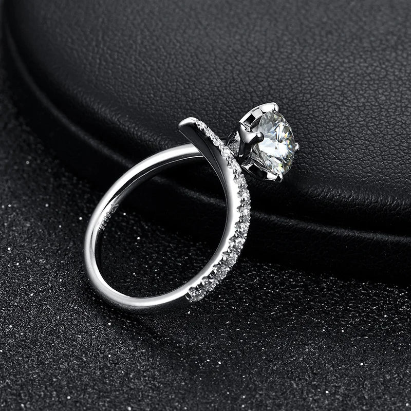 Sterling silver ring styled among rings with moissanite for layered shine