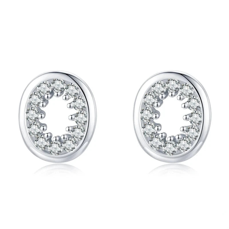 Full paved clear CZ oval stud earrings on white card showing cz sparkle