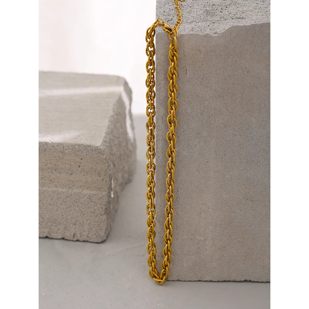 Close view of necklace with gold showing chain with gold polish