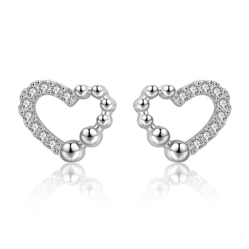 Whimsical heart stud earrings in 925 sterling silver with gentle cz sparkle