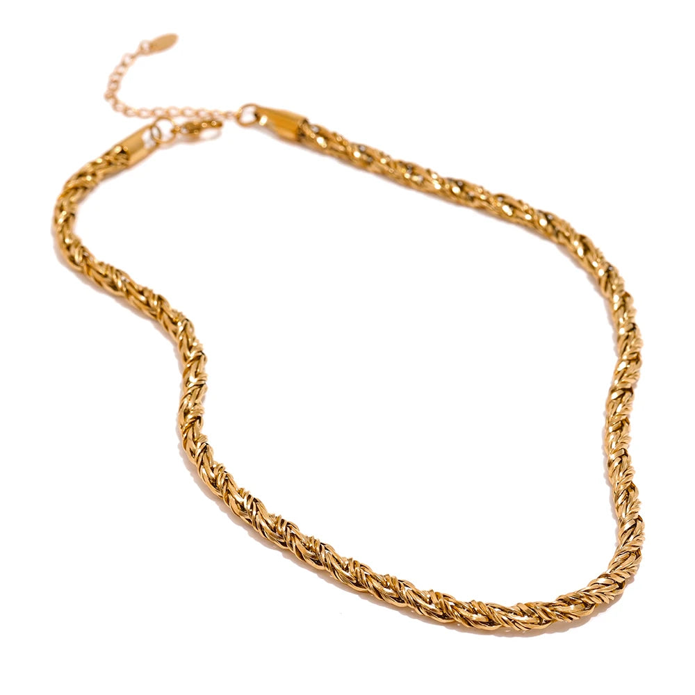 A gold bracelet shown with gold chain gold necklace for cohesive shine