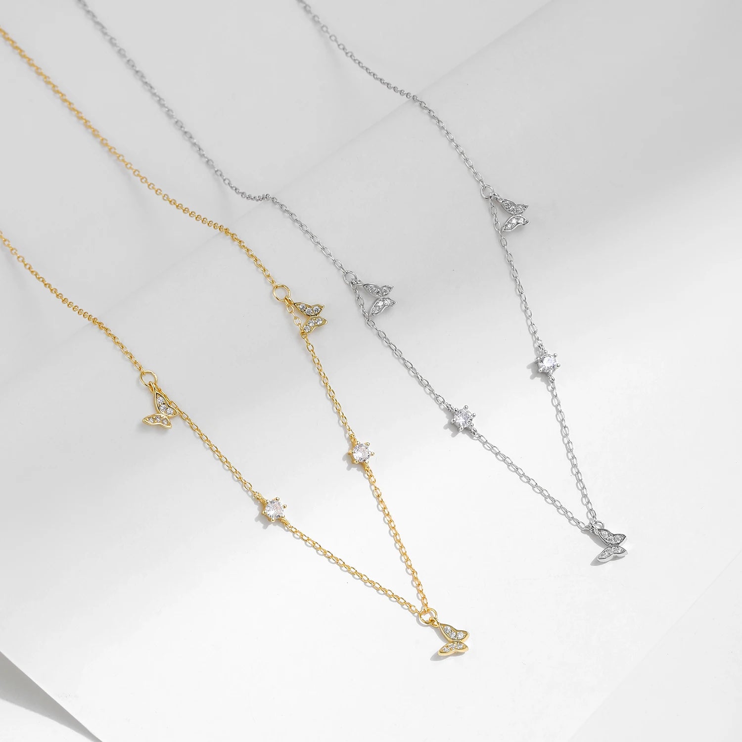 Silver chain supporting a delicate sterling silver necklace