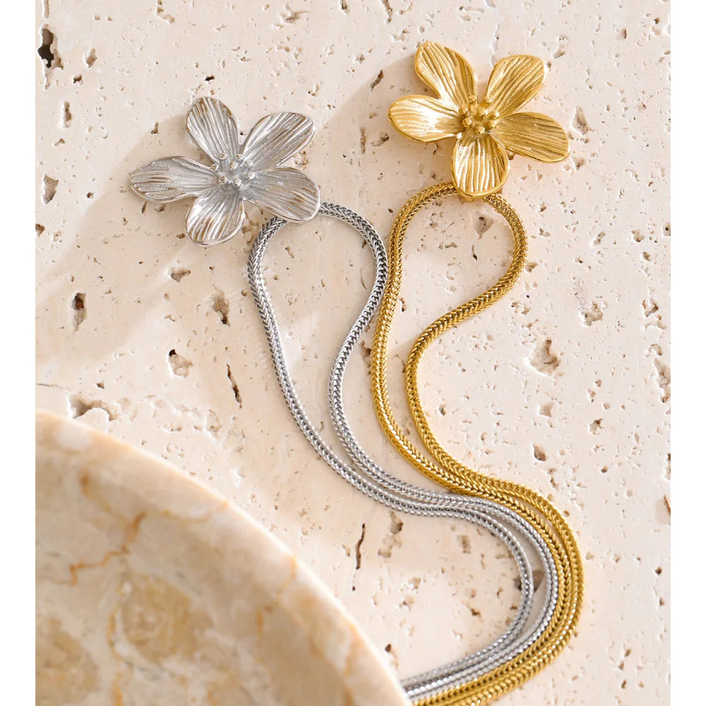 Women wearing gold necklace necklace flower charm accessory