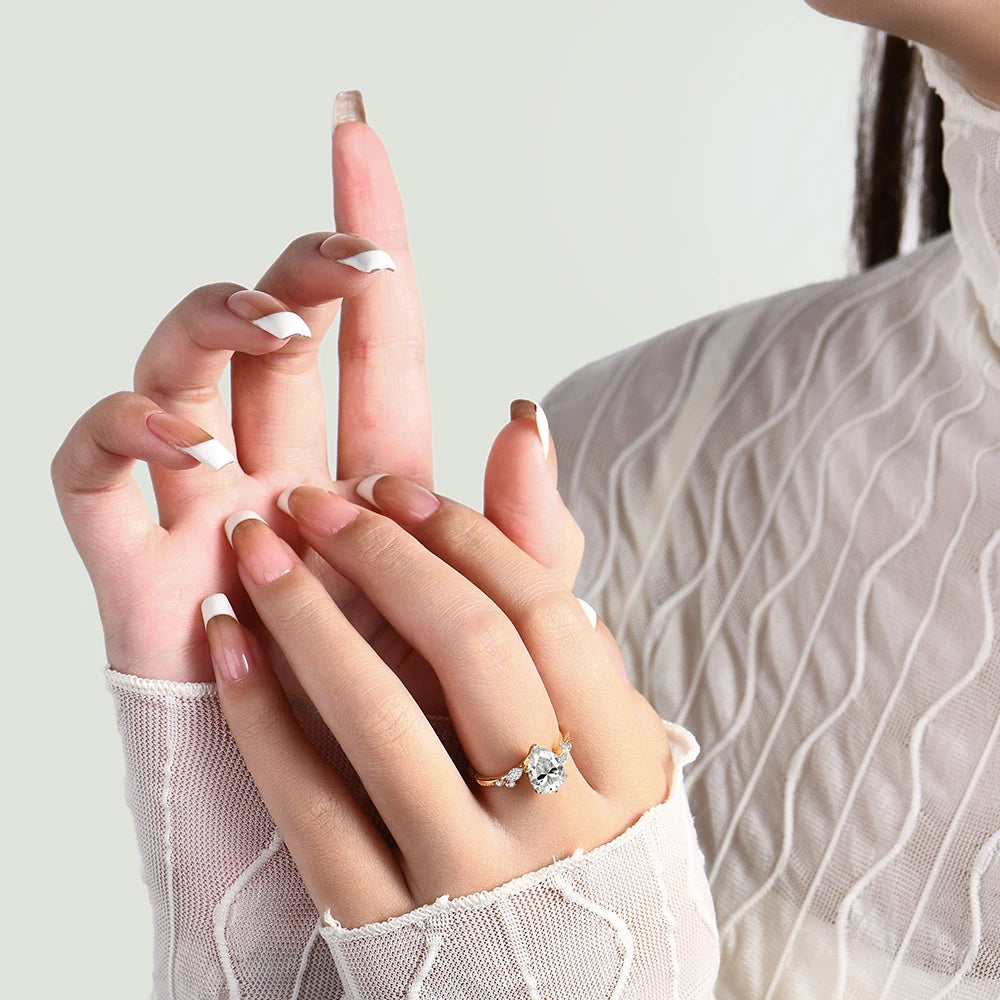 Gold rings accent around a moissanite ring on a silver ring band