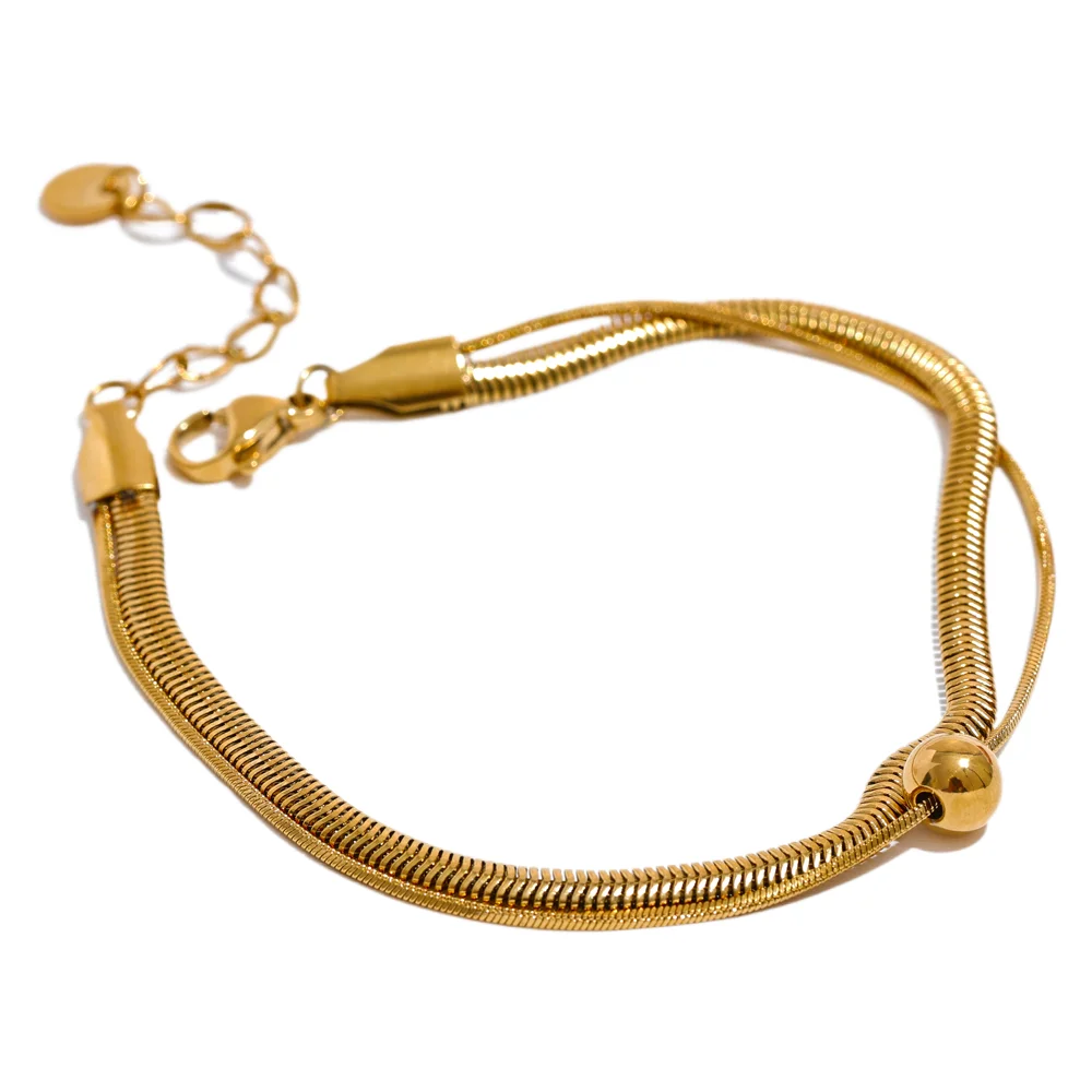 Flat lay of gold chain and bracelet chain for simple styling
