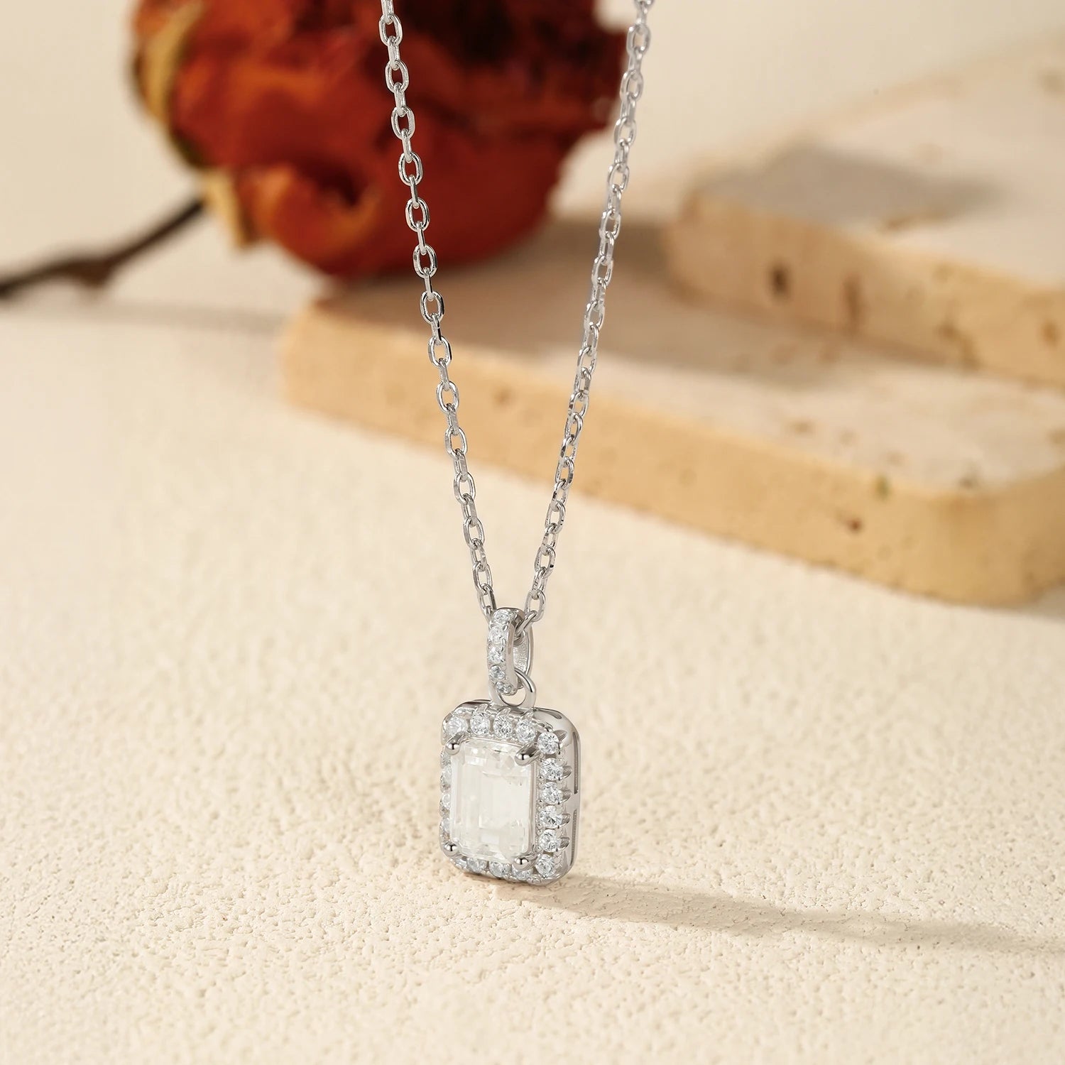 Elegant pendant necklace featuring halo moissanite gemstone and silver