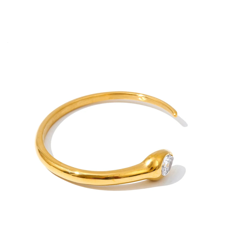 Modern gold bangle bangle with snake shape silhouette