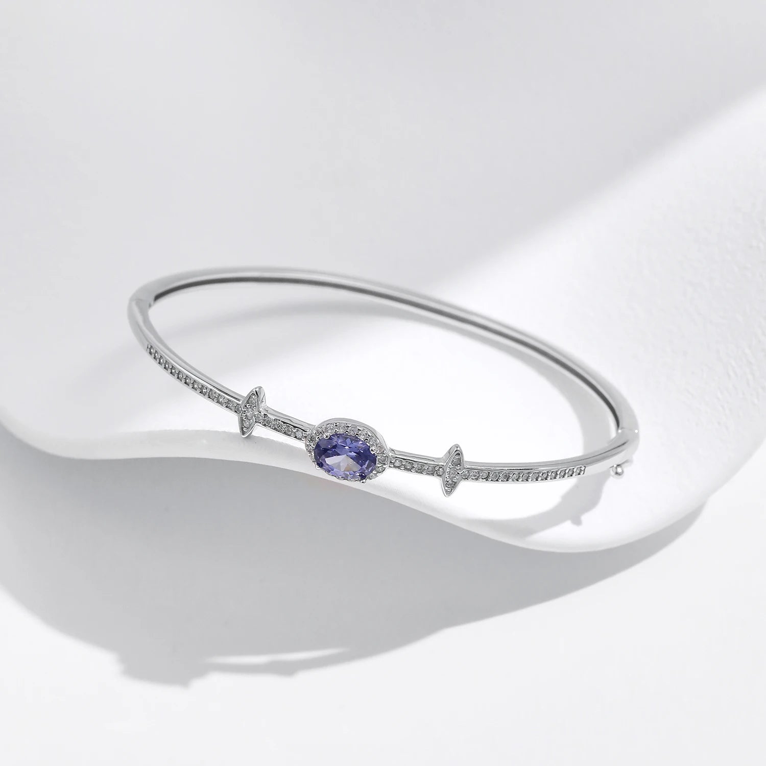 Silver bangle stack paired with a Tanzania CZ sterling silver bracelet