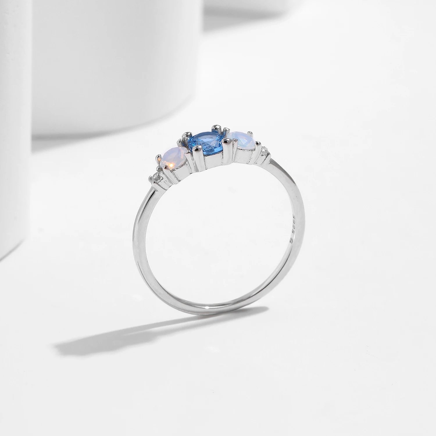 Fashion ring with luminous opal and zircon accents