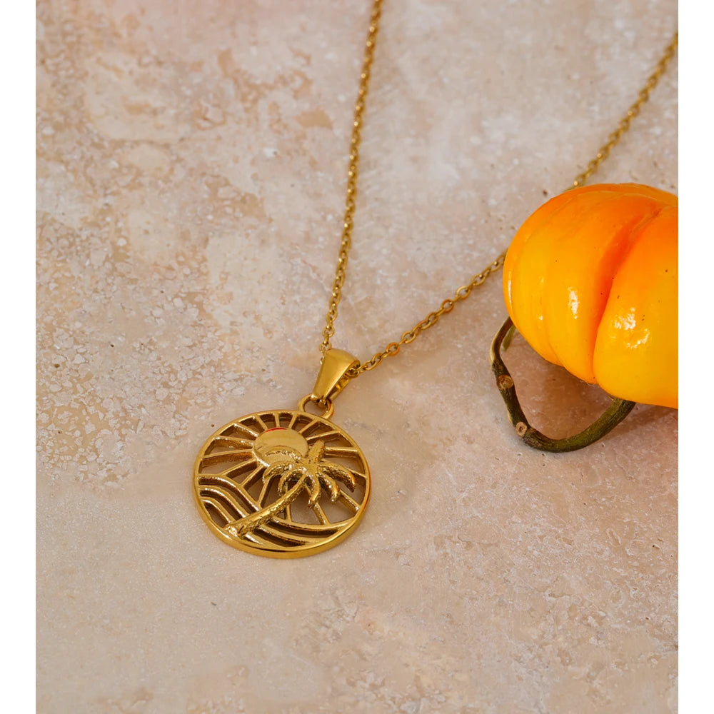 tropical gold necklace with sun and coconut tree pendant in stainless steel
