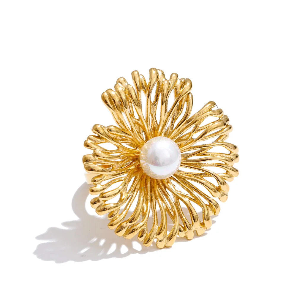 Gold and ring structure featuring pearl jewelry charm