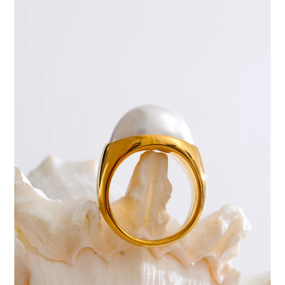 Gold plated stainless steel rings featuring simulated pearls on finger