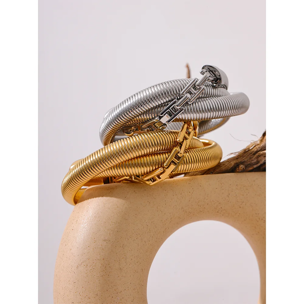 A gold bracelet styled as bracelet gold bracelet on the wrist