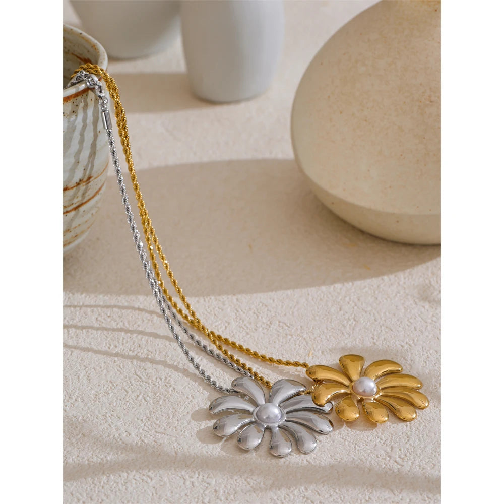 Layered necklace and necklace look featuring a gold i necklace with floral charm