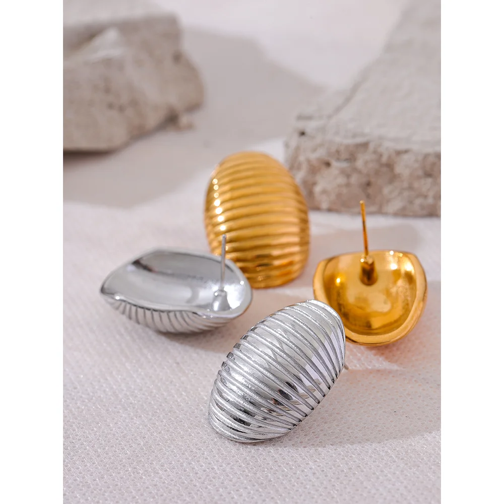 Everyday gold earrings arranged with matching ear rings