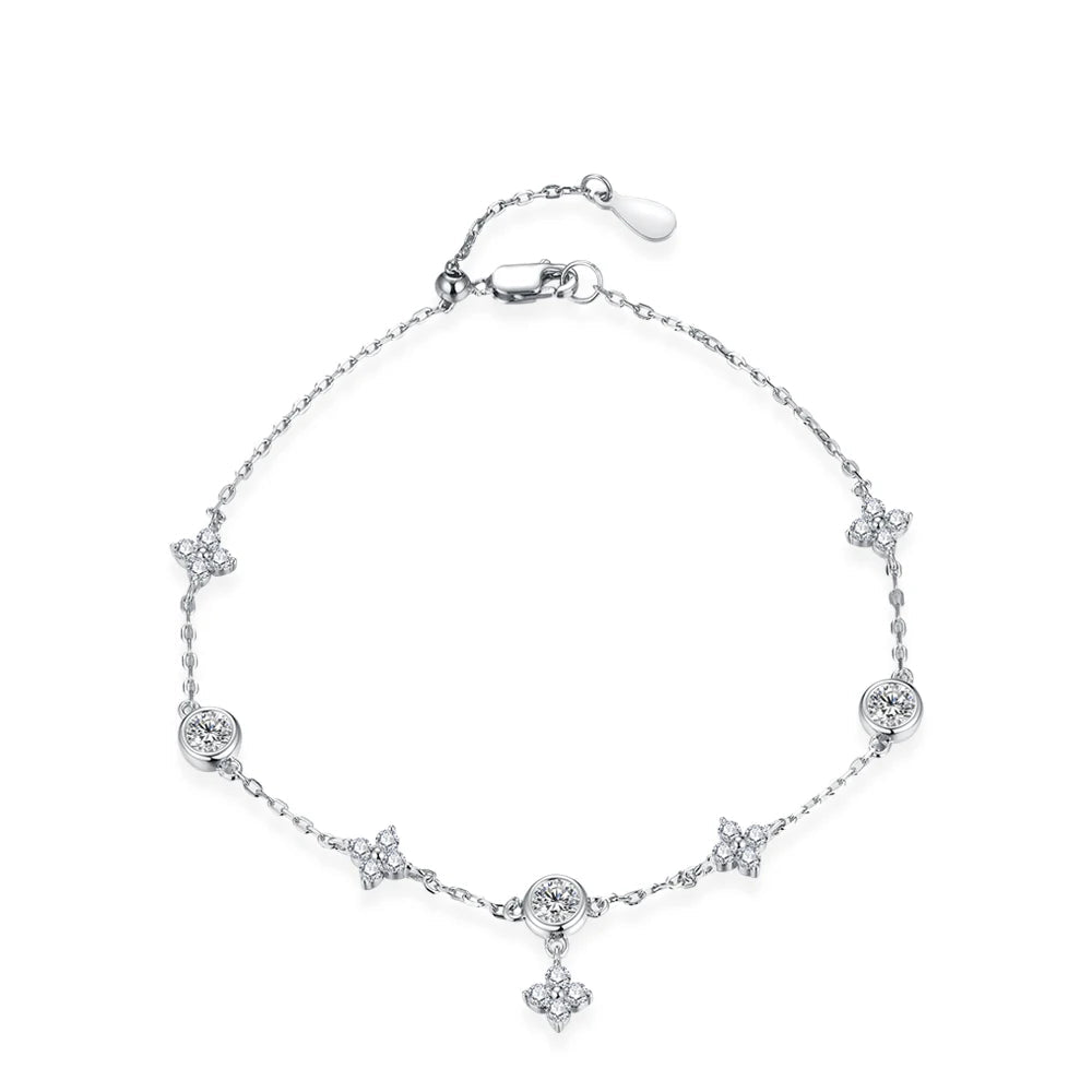 A silver bracelet with round-cut moissanite stones and pearls, featuring an adjustable clasp.