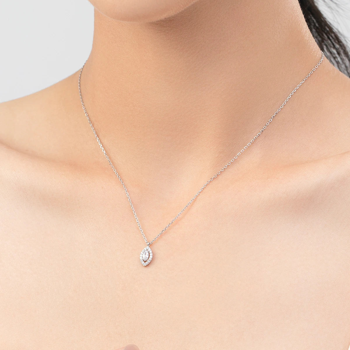 Geometric rhombus zircon pendant on fine chain silver tone