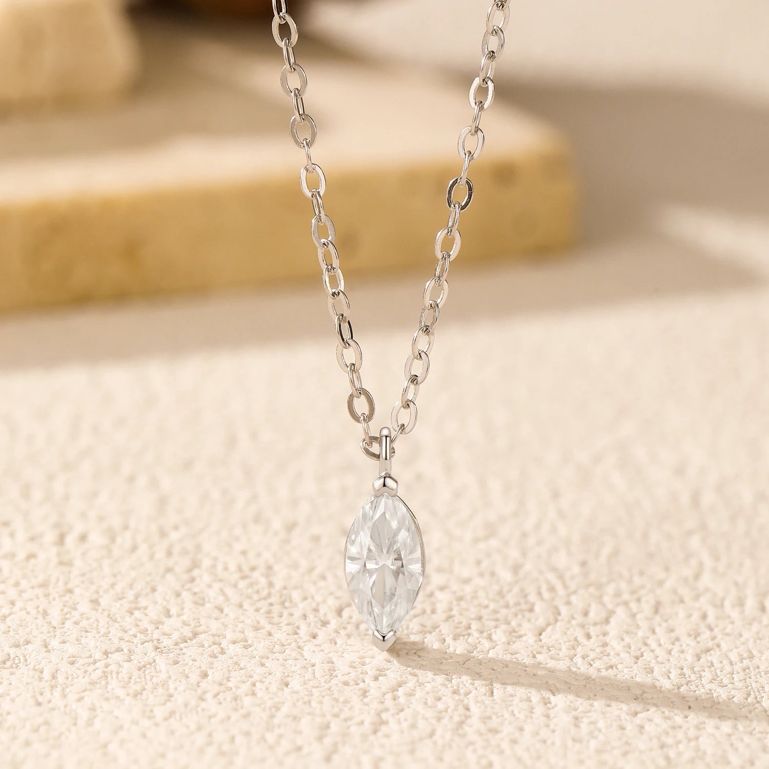 Women’s pendant necklaces design featuring polished silver and moissanite