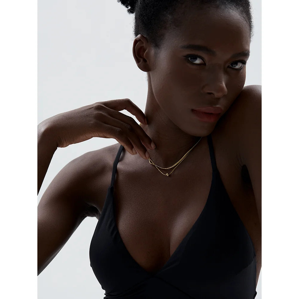 Gold i necklace styled for necklace and necklace layering