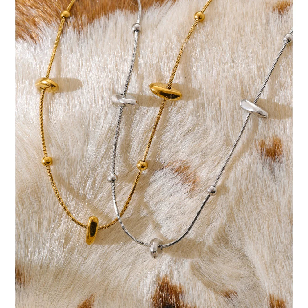 Close up of elegant gold chain necklace with matching bracelet