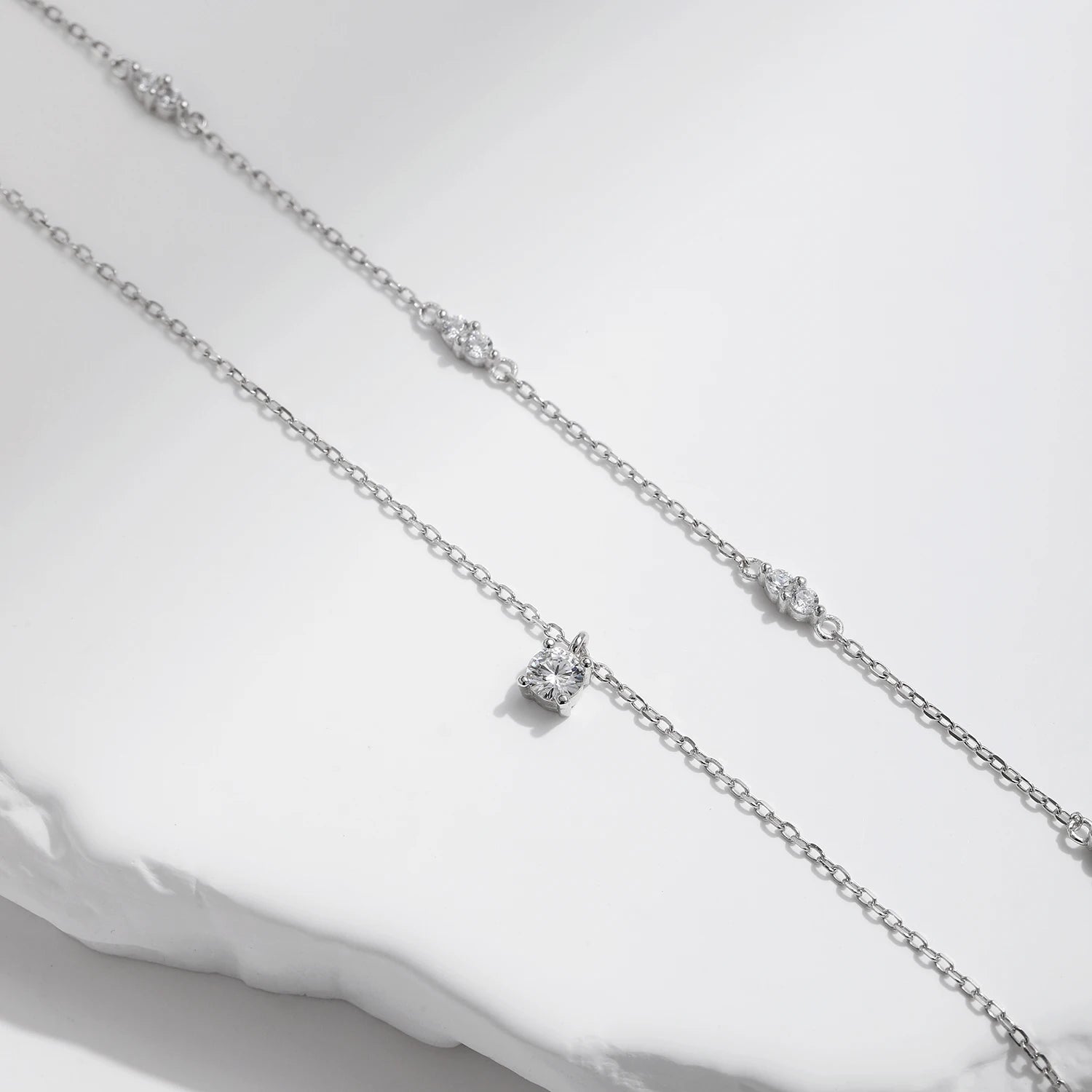 925 sterling silver chain necklace supporting a bright pendant necklace