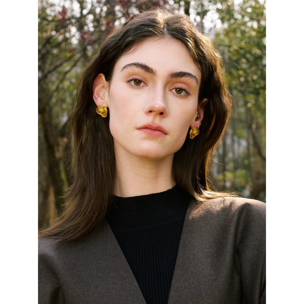 Gift box display showing earrings and gold with a coordinating gold ring