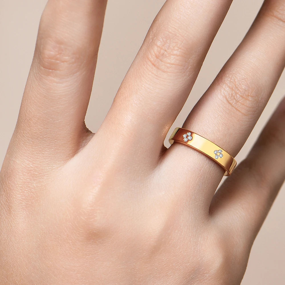 Rings with moissanite paired around a floral moissanite wedding ring