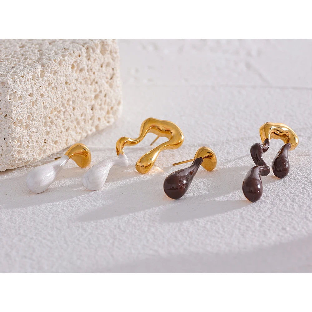 Close-up of white and brown enamel detailing on earrings