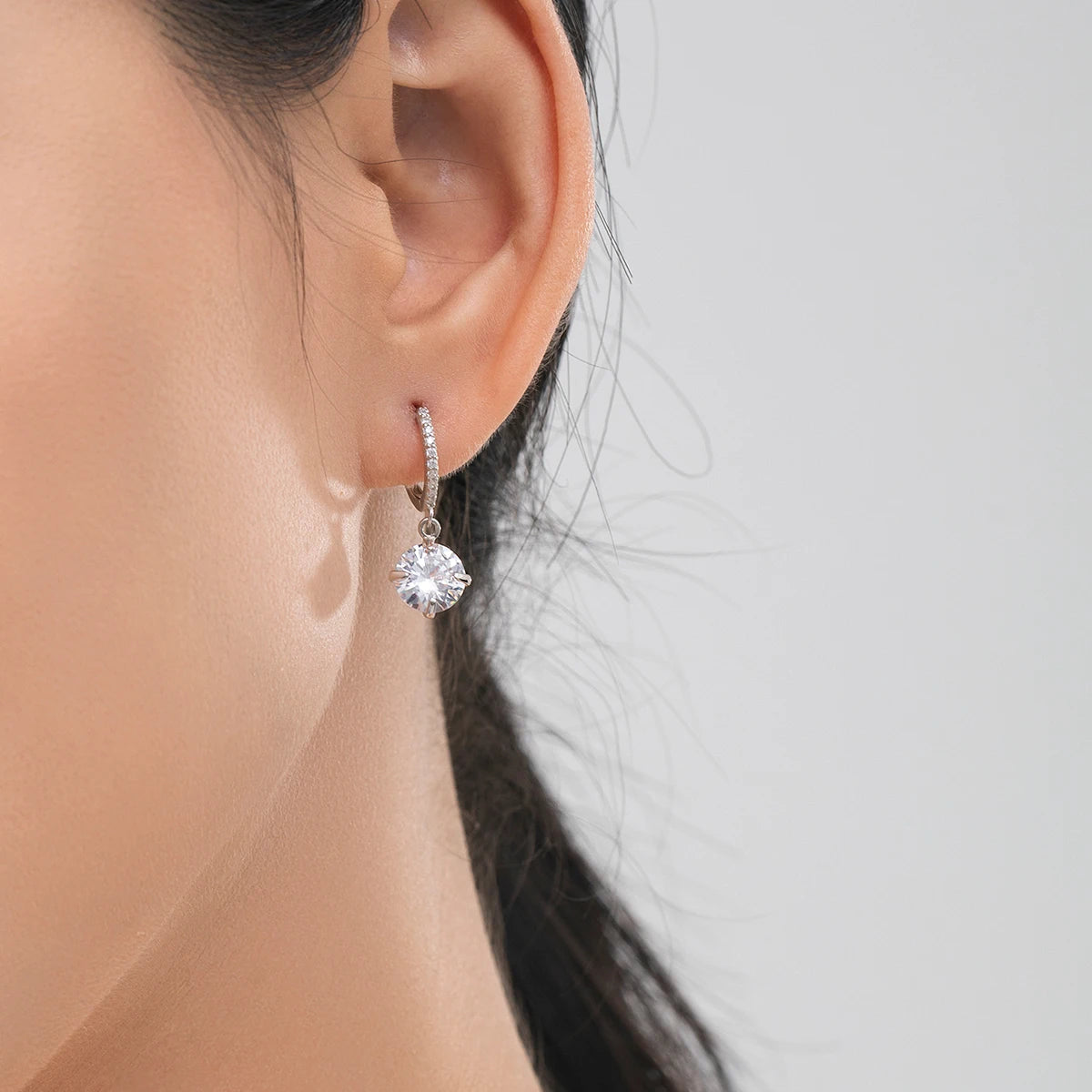 Radiant cubic zirconia swing hoops in sterling silver